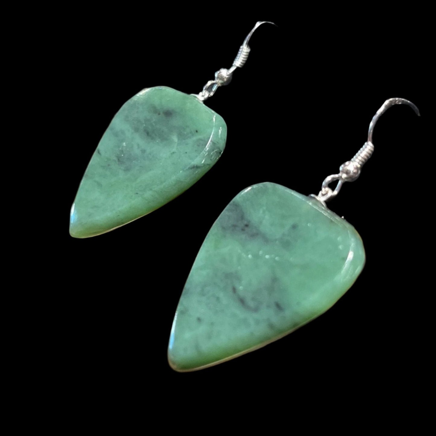 Functional Alaskan Jade guitar pick earrings in sterling silver. Made and tested by a guitar player. This unique piece of jewelry is authentic Alaska Native art created by an enrolled member of an Alaska Native tribe. Certified Silver Hand and Made in Alaska jewelry.