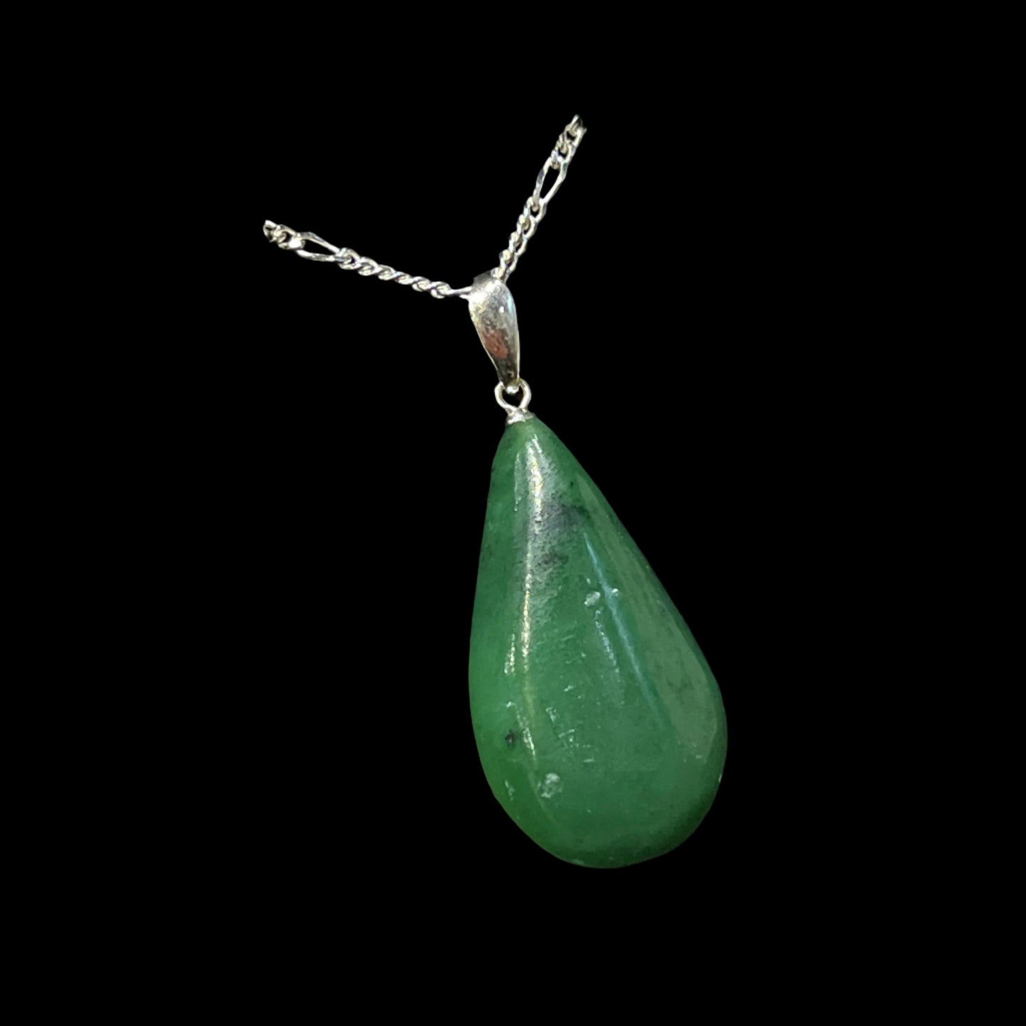 Alaskan Jade Pendant in silver. Certified Made in Alaska. This unique piece of jewelry is authentic Alaska Native art created by an enrolled member of an Alaska Native tribe.