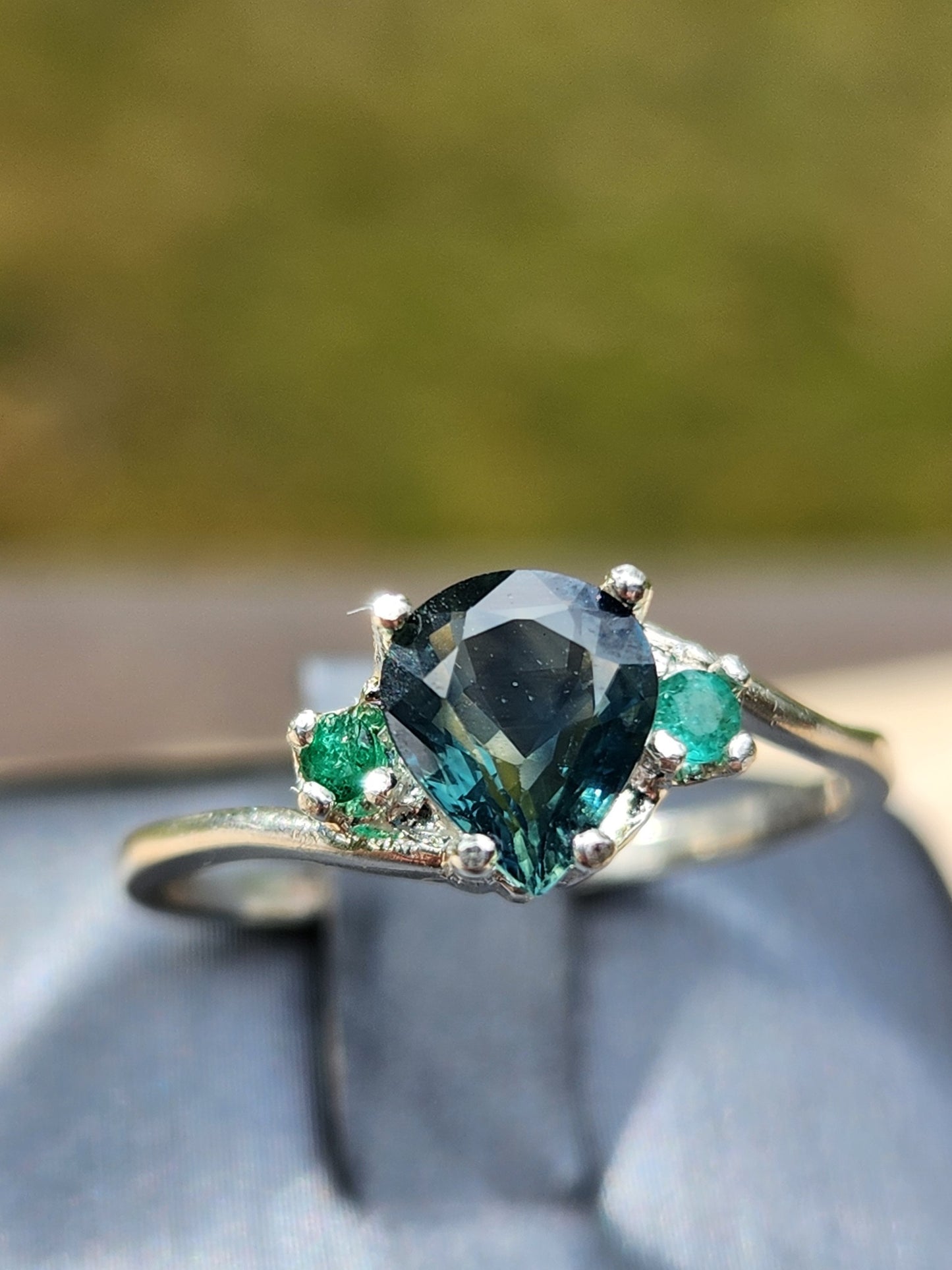 Blue green Sapphire with Columbian Emerald accents, size 6.5