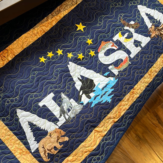 Alaska Runner quilt with channel on back for hanging. Measures approx. 49”h x 31”w 