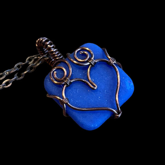 Blue sea glass pendant with copper wrap heart from Seldovia