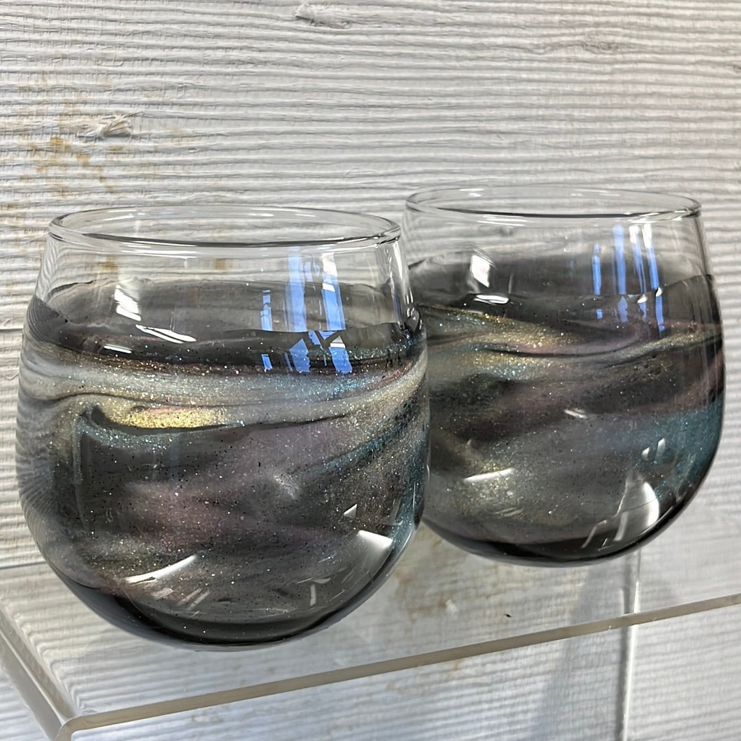 Set of 2 Translucent Gold Aurora stemless wine glasses.