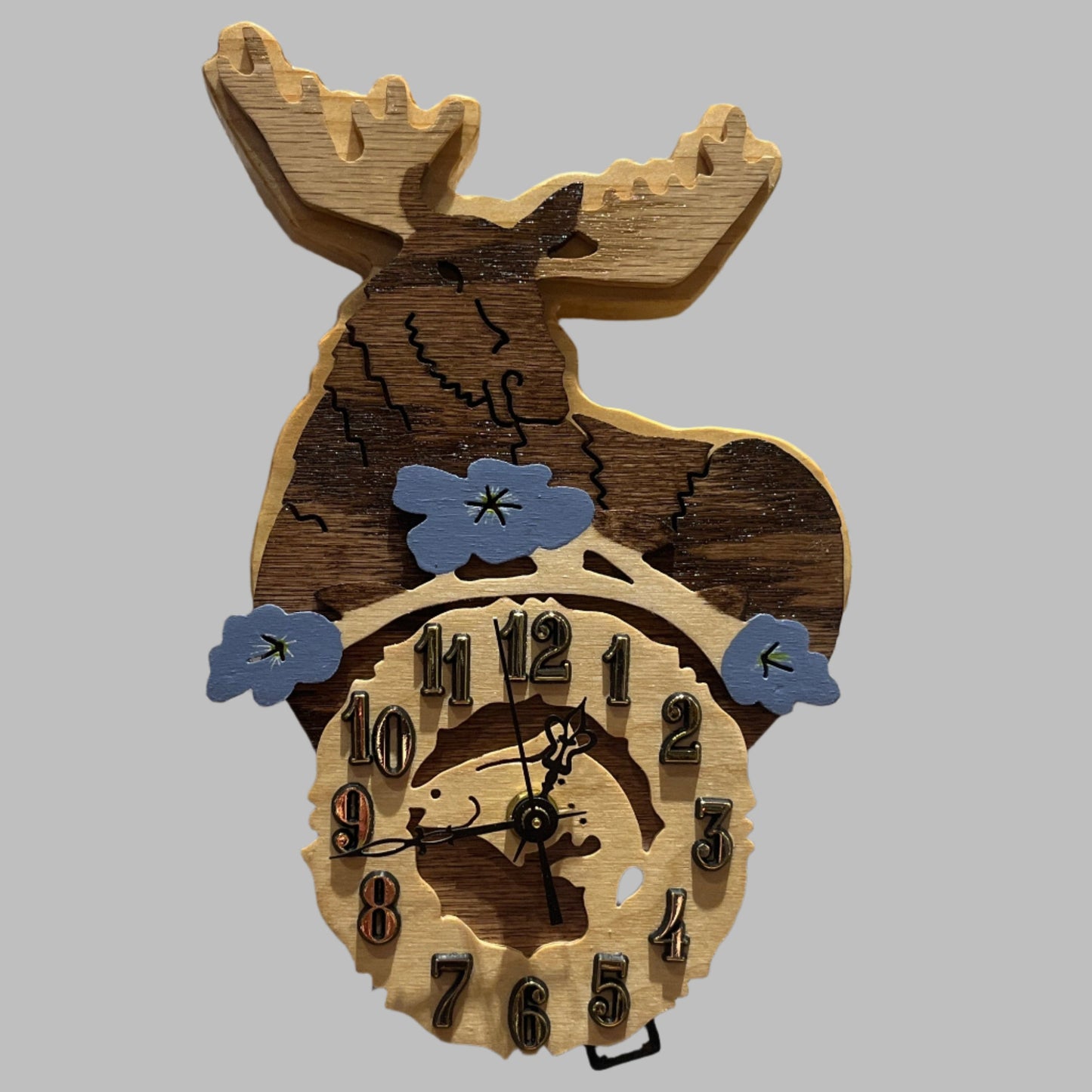 Wooden moose pendulum clock, hand scroll sawed, with high quality quartz movements, designed for years of service. One AA battery included. Certified Made in Alaska.