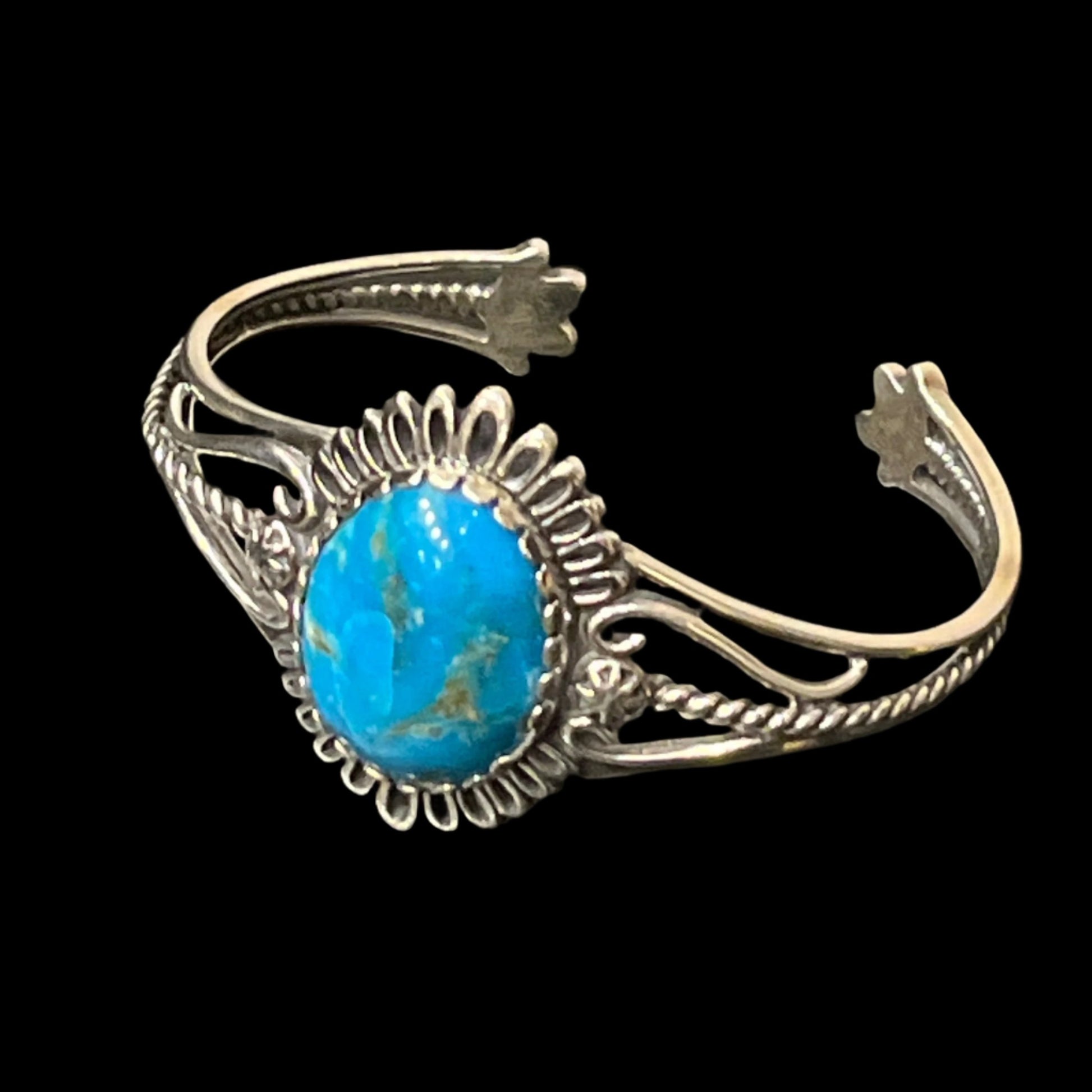 Turquoise in sterling silver cuff bracelet. Made in Alaska Sterling silver cuff bracelet with turquoise centerpiece. This unique piece of jewelry is authentic Alaska Native art created by an enrolled member of an Alaska Native tribe.