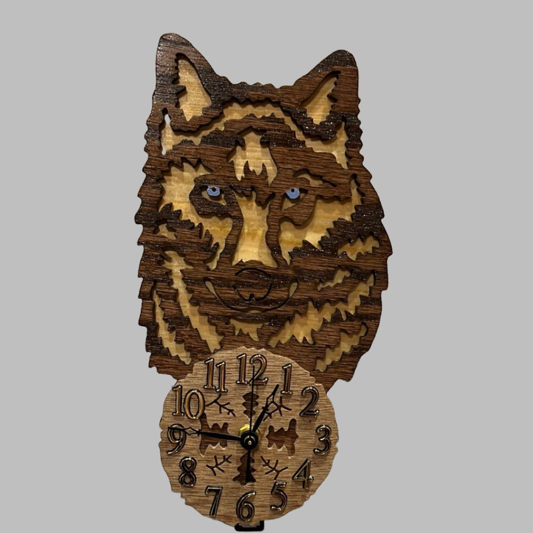 Wooden wolf pendulum clock, hand scroll sawn, with high quality quartz movements, designed for years of service. One AA battery included.