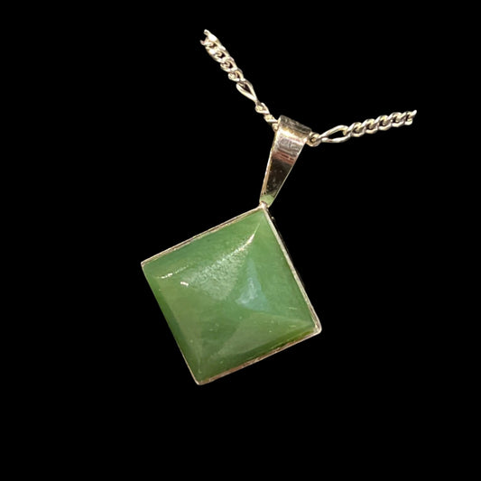 Alaskan Jade Pendant, offset square, in silver setting. Certified Made in Alaska. This unique piece of jewelry is authentic Alaska Native art created by an enrolled member of an Alaska Native tribe.