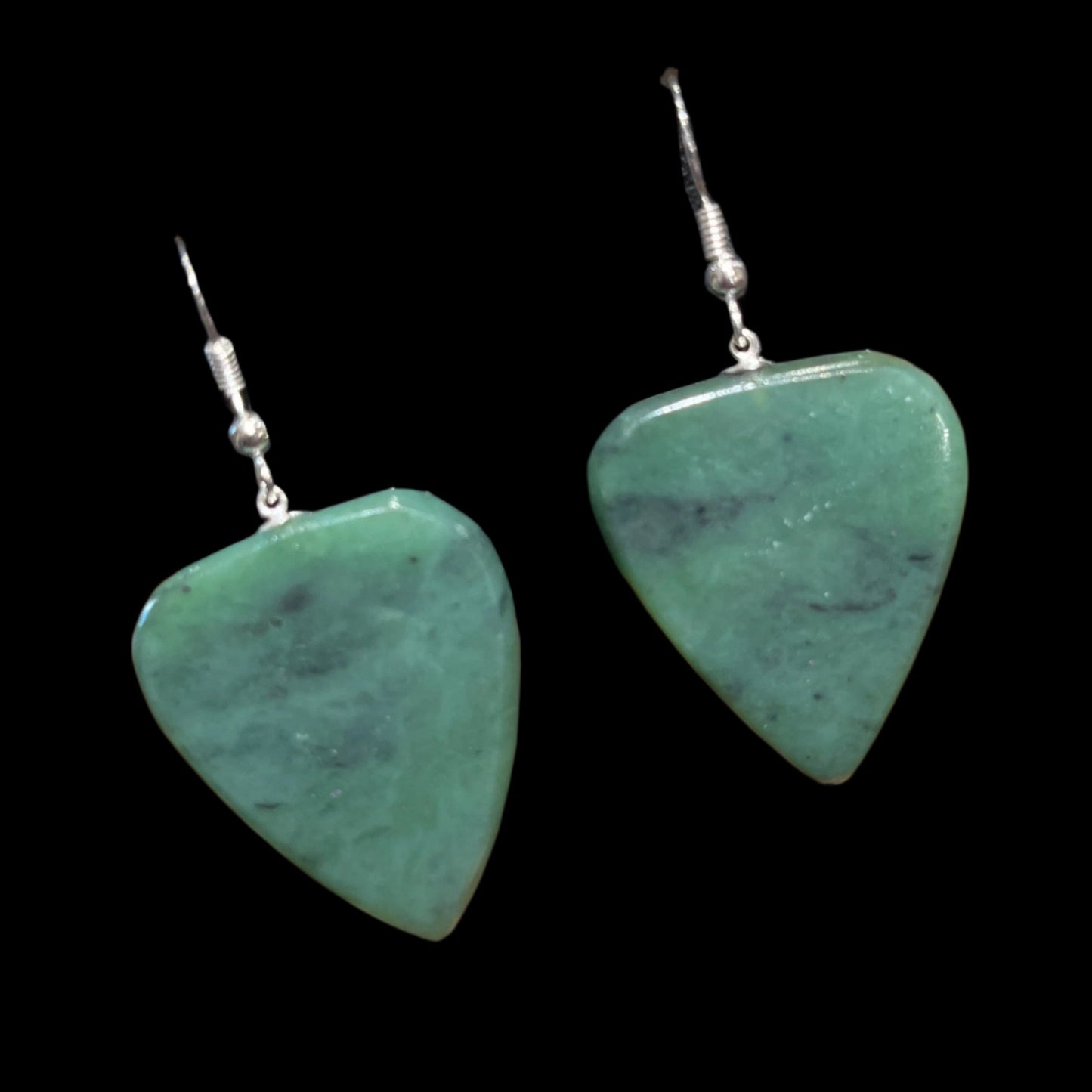 Functional Alaskan Jade guitar pick earrings in sterling silver. Made and tested by a guitar player. This unique piece of jewelry is authentic Alaska Native art created by an enrolled member of an Alaska Native tribe. Certified Silver Hand and Made in Alaska jewelry.