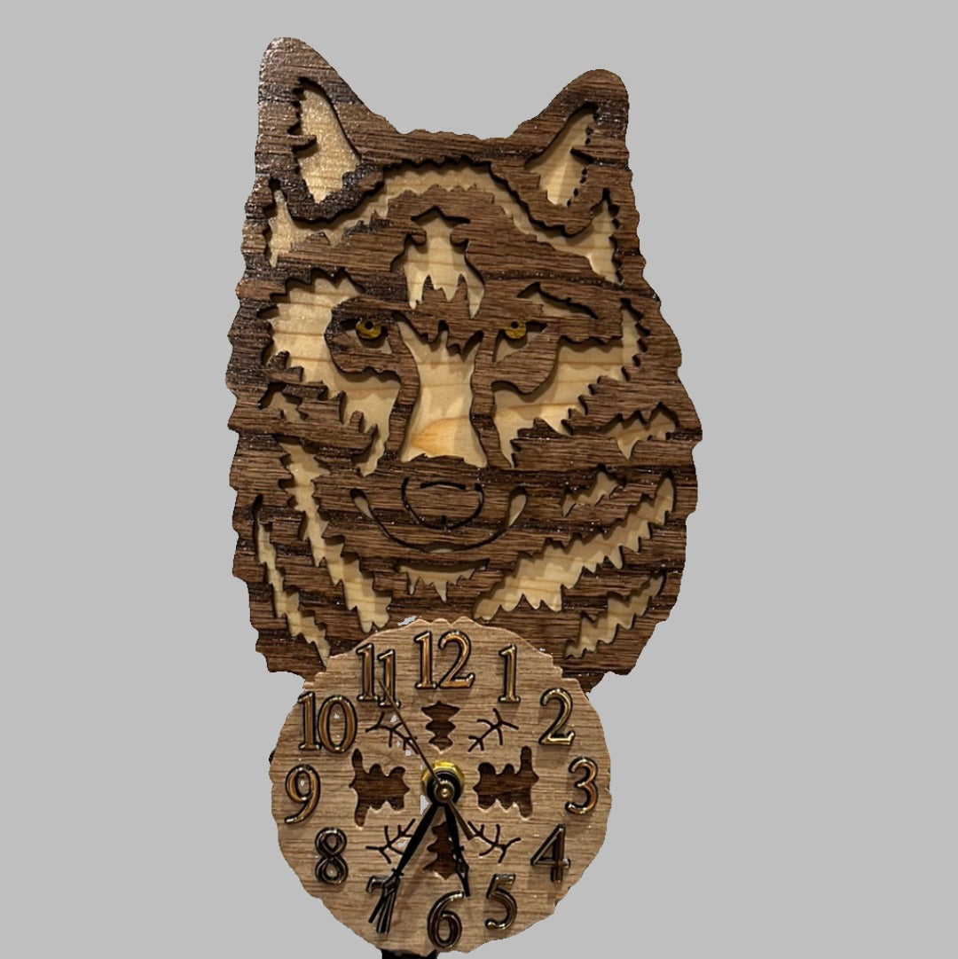 Wooden wolf pendulum clock, hand scroll sawn, with high quality quartz movements, designed for years of service. One AA battery included.