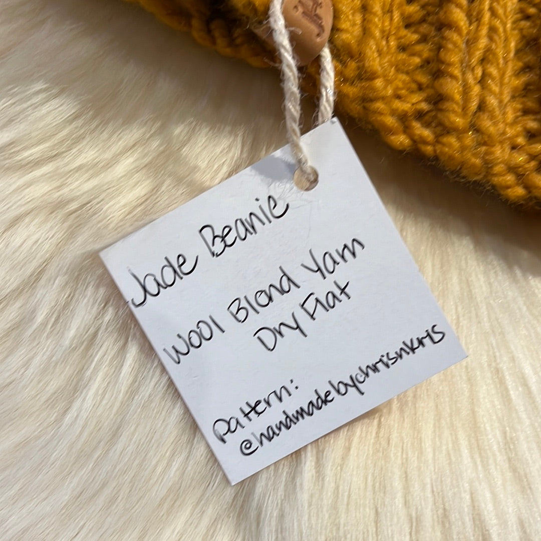 Jade Beanie (Mustard) Wool blend yarn with removable pom pom. Care: Remove pom, gentle wash dry flat.