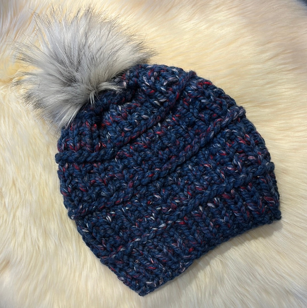 Orchard Beanie (Blue) Wool acrylic blend yarn with removable pom pom. Care: Remove pom, gentle wash dry flat.