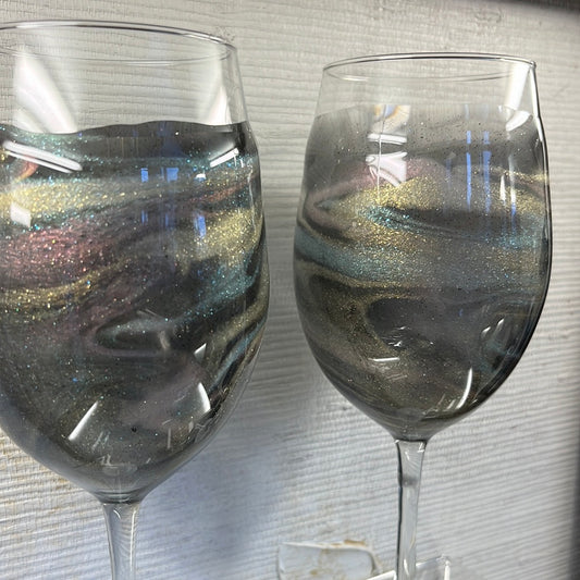 Set of 2 resin finished translucent Gold Aurora wine glasses.