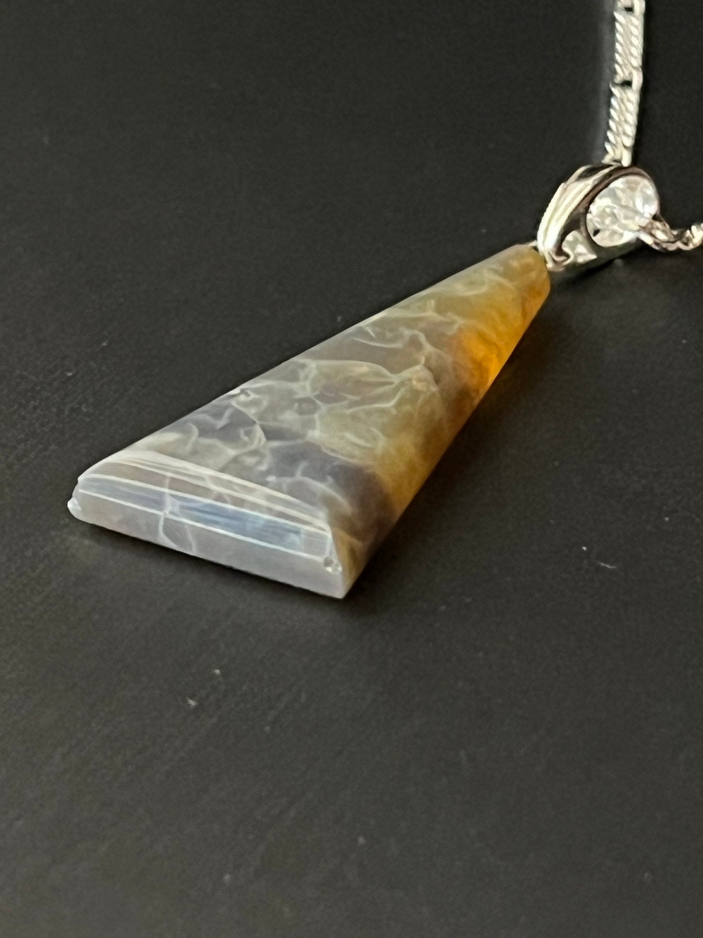 20.29 carat Australian Opal pendant in sterling silver. This unique piece of jewelry is authentic Alaska Native art created by an enrolled member of an Alaska Native tribe and is a certified Made in Alaska item. 