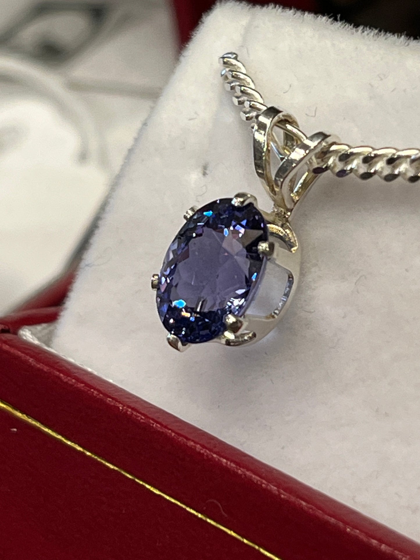 Brilliant 2.49 carat oval Tanzanite pendant in sterling silver on chain. This unique piece of jewelry is authentic Alaska Native art created by an enrolled member of an Alaska Native tribe. 