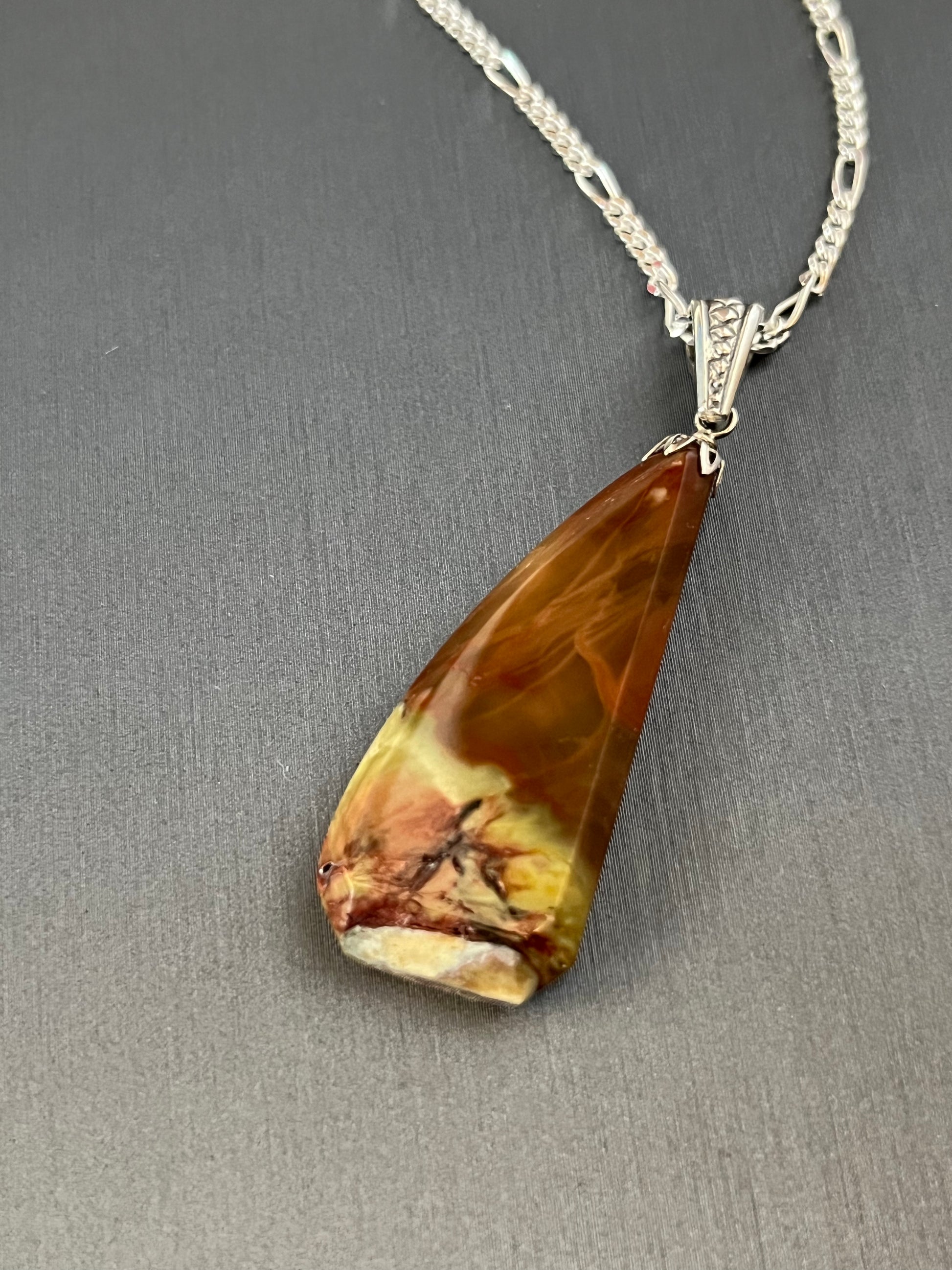 Carrasite Porcelain Jasper pendant on silver. This unique piece of jewelry is authentic Alaska Native art created by an enrolled member of an Alaska Native tribe.