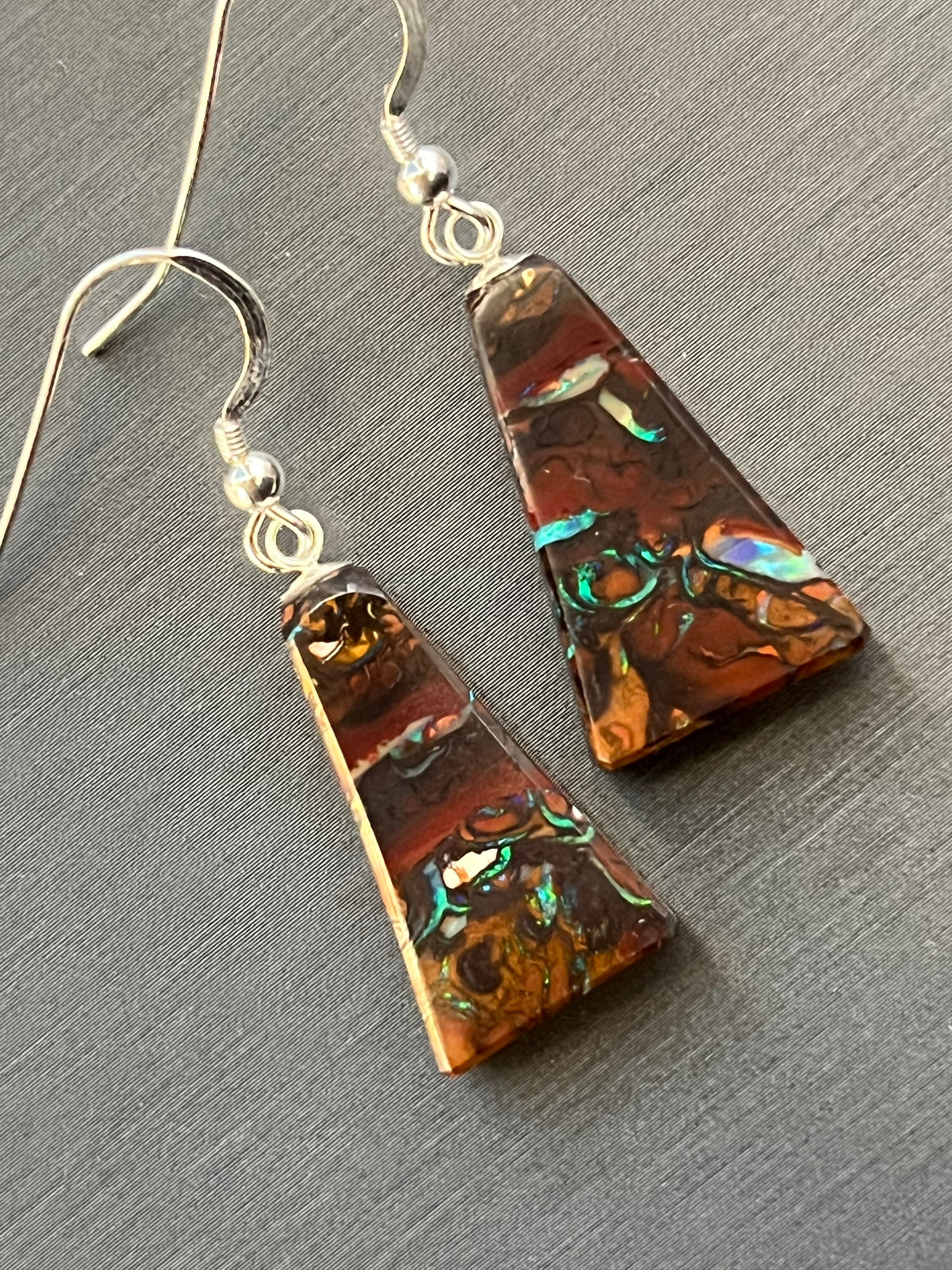 Australian Korite Opal earrings in silver in a thick pyramid shape exposing beautiful veins. This unique piece of jewelry is authentic Alaska Native art created by an enrolled member of an Alaska Native tribe. Certified Silver Hand and Made in Alaska jewelry.