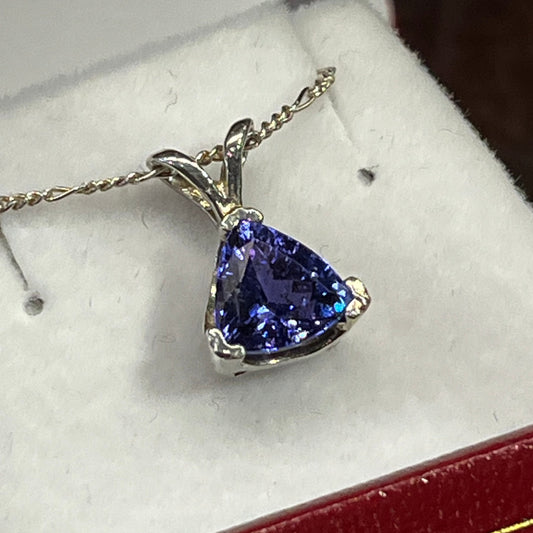Triangular 1.42 carat Tanzanite pendant in silver. This rare gemstone is a birthstone of December, and is a traditional 24th anniversary gift. This unique piece of jewelry is authentic Alaska Native art created by an enrolled member of an Alaska Native tribe. Certified Silver Hand and Made in Alaska jewelry.