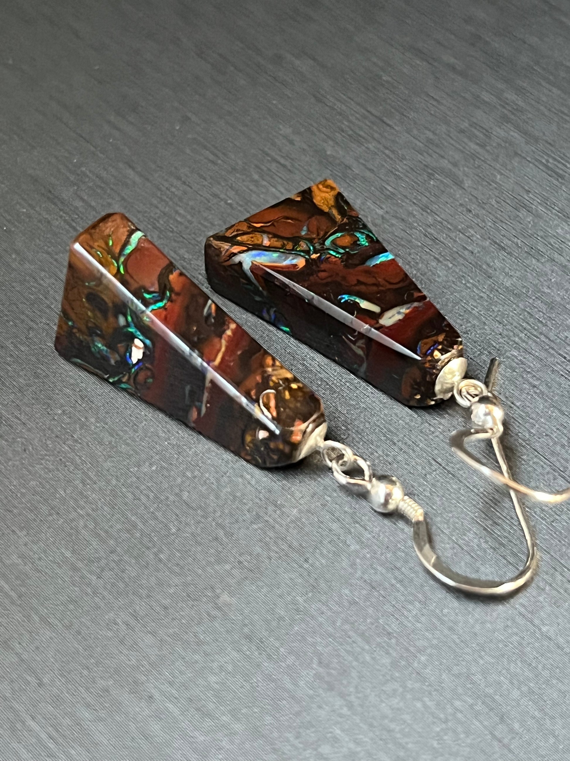 Australian Korite Opal earrings in silver in a thick pyramid shape exposing beautiful veins. This unique piece of jewelry is authentic Alaska Native art created by an enrolled member of an Alaska Native tribe. Certified Silver Hand and Made in Alaska jewelry.