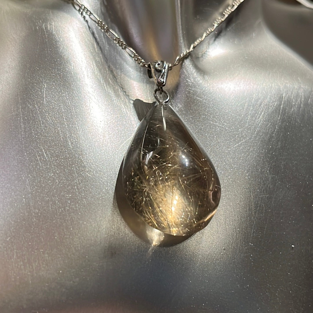 Teardrop-shaped Rutilated Quartz Pendant on silver chain. This unique piece of jewelry is authentic Alaska Native art created by an enrolled member of an Alaska Native tribe. 