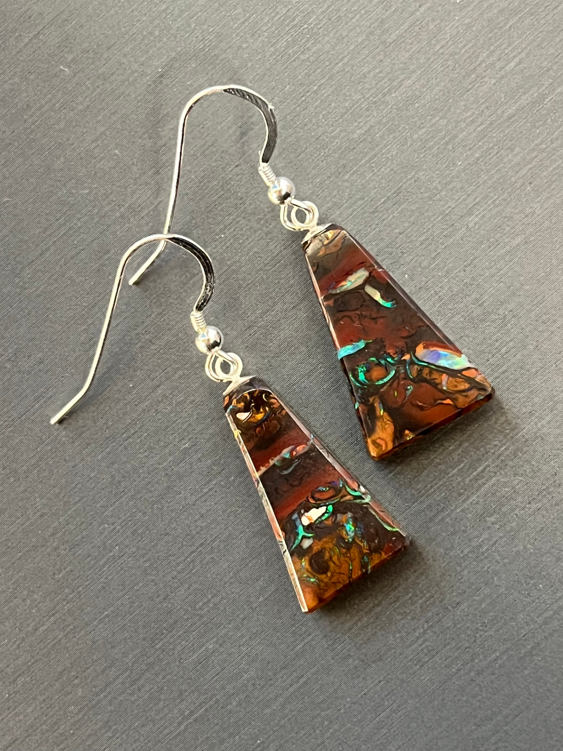 Australian Korite Opal earrings in silver in a thick pyramid shape exposing beautiful veins. This unique piece of jewelry is authentic Alaska Native art created by an enrolled member of an Alaska Native tribe. Certified Silver Hand and Made in Alaska jewelry.