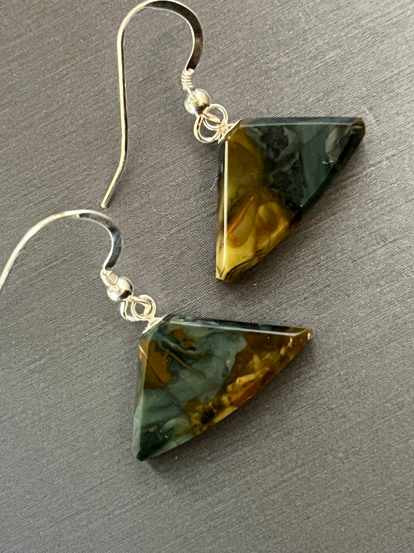 Morrisonite Jasper Earrings on silver in an ulu shape. This unique piece of jewelry is authentic Alaska Native art created by an enrolled member of an Alaska Native tribe. Certified Silver Hand and Made in Alaska jewelry..